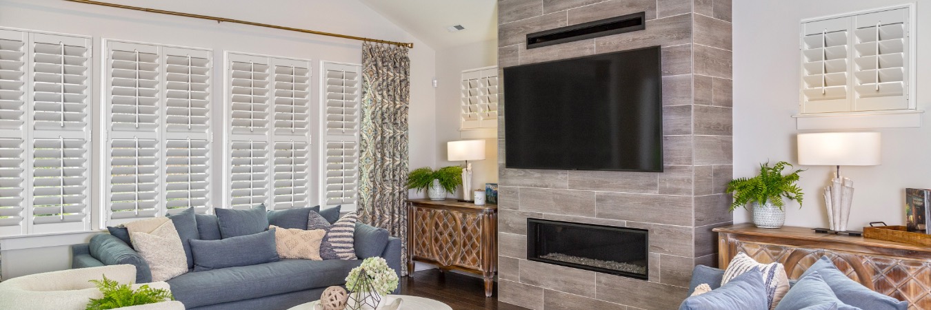 Interior shutters in Williamson County living room with fireplace
