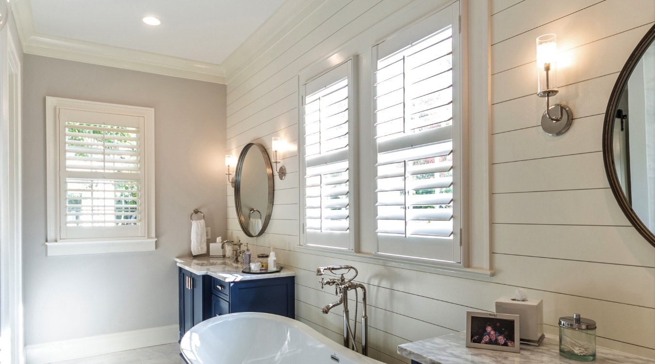 Austin bathroom with white plantation shutters.