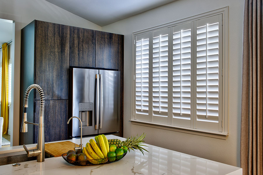 White Polywood shutters on a large kitchen window