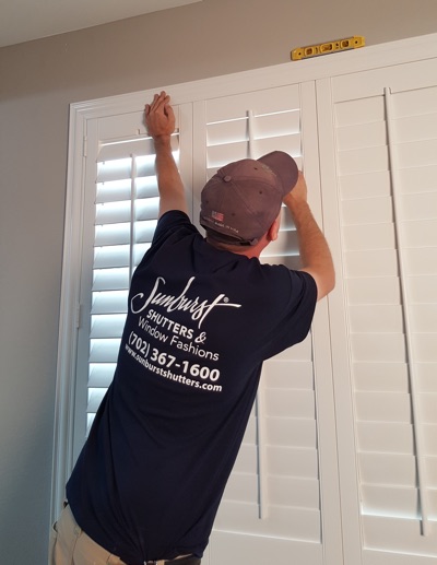 Shutter installation in Austin bedroom.