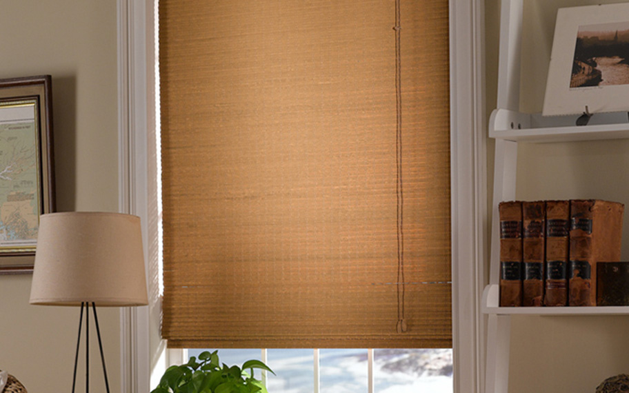 Add a touch of nature to your decor with woven fiber shades in Austin. Tan woven fiber shades in a living room