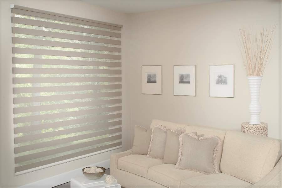 Zebra shades give you a unique combination of light control and style that benefits your Austin home. Zebra shade allows filtered light into a living room