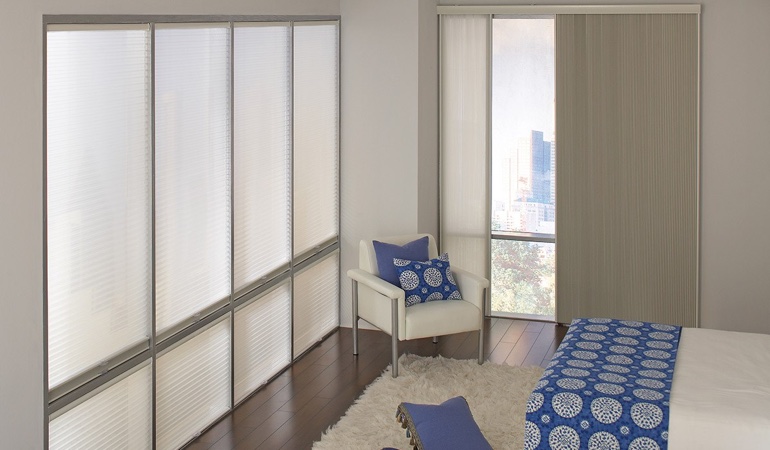Cellular shades are another choice to support a minimalist design. Cellular shades in a modern bedroom.