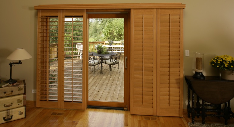 You can even match your wood shutters to your patio. Austin wood shutter sliding door