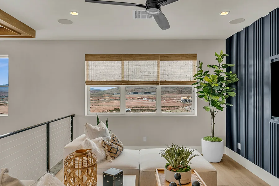 Austin homeowners who want eco-friendly home fixtures should consider natural woven shades. Natural brown woven shades on a window in a stylish sitting area