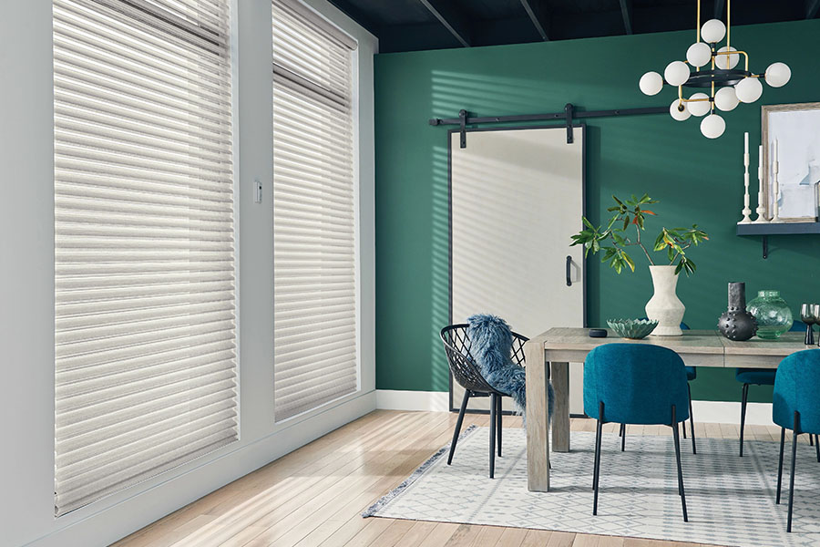 Versatile sheer shades let you decide how much of a view you want while enjoying your Austin dining room. White sheer shades on windows in a green dining room