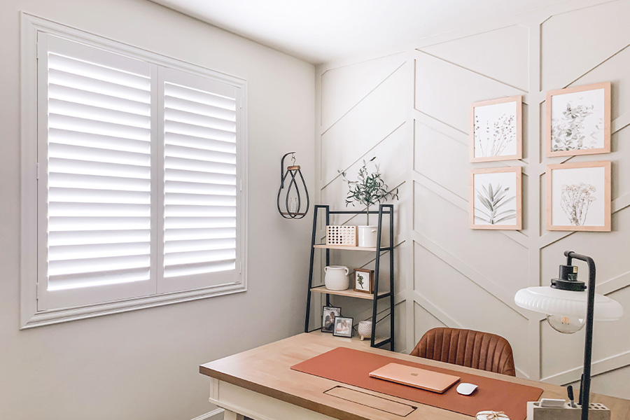 Polywood shutters give you maximum control over natural light in your Austin home. Photo Credit: @OurLakepoint Farmhouse White and off-white farmhouse style office with natural light from polywood shutters.
