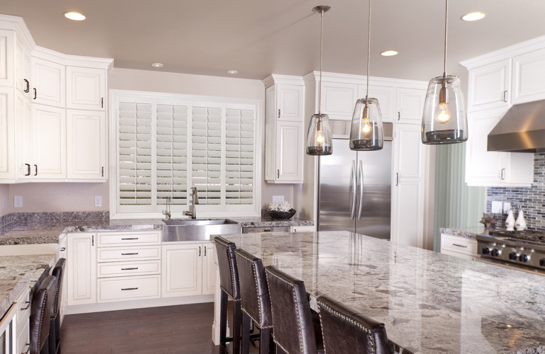 Kitchen Shutters In Austin, TX Plantation shutters covering a kitchen window